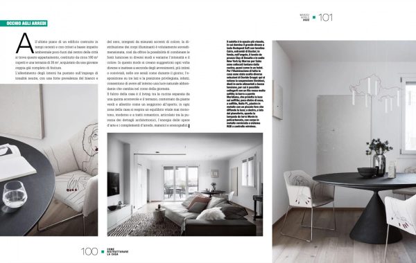 doppia pagina di Come Ristrutturare la Casa aprile 2022, zona pranzo e living dell’attico a Bologna con tavolo rotondo nero e vista terrazza