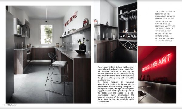 pagina G&G Magazine: cucina con piani in acciaio e insegna al neon “SMELLS LIKE ART” nell’Attico Contemporaneo a Bologna