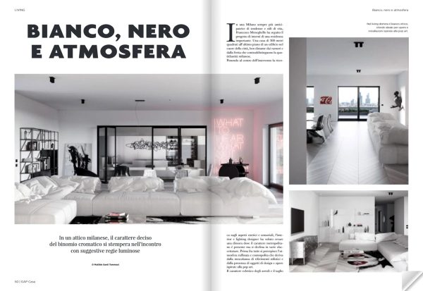 doppia pagina di GAP Casa maggio 2022, attico a Milano con palette bianco e nero, living luminoso e dettagli grafici