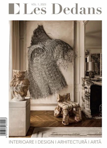 cover of Les Dedans, December 2023, interior with textile artwork, sculpture and marble fireplace