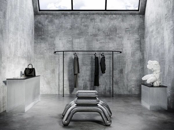 cabina armadio brutalista con un appendiabiti nero minimalista, panca scultorea in metallo lucido e statua classica bianca