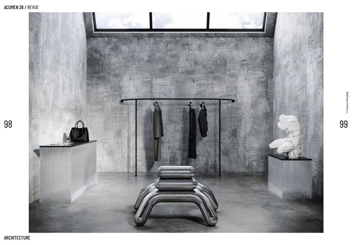 Acumen spread: wardrobe area of the Industrial Loft in London with a sculptural chrome bench and clothes rail under a skylight
