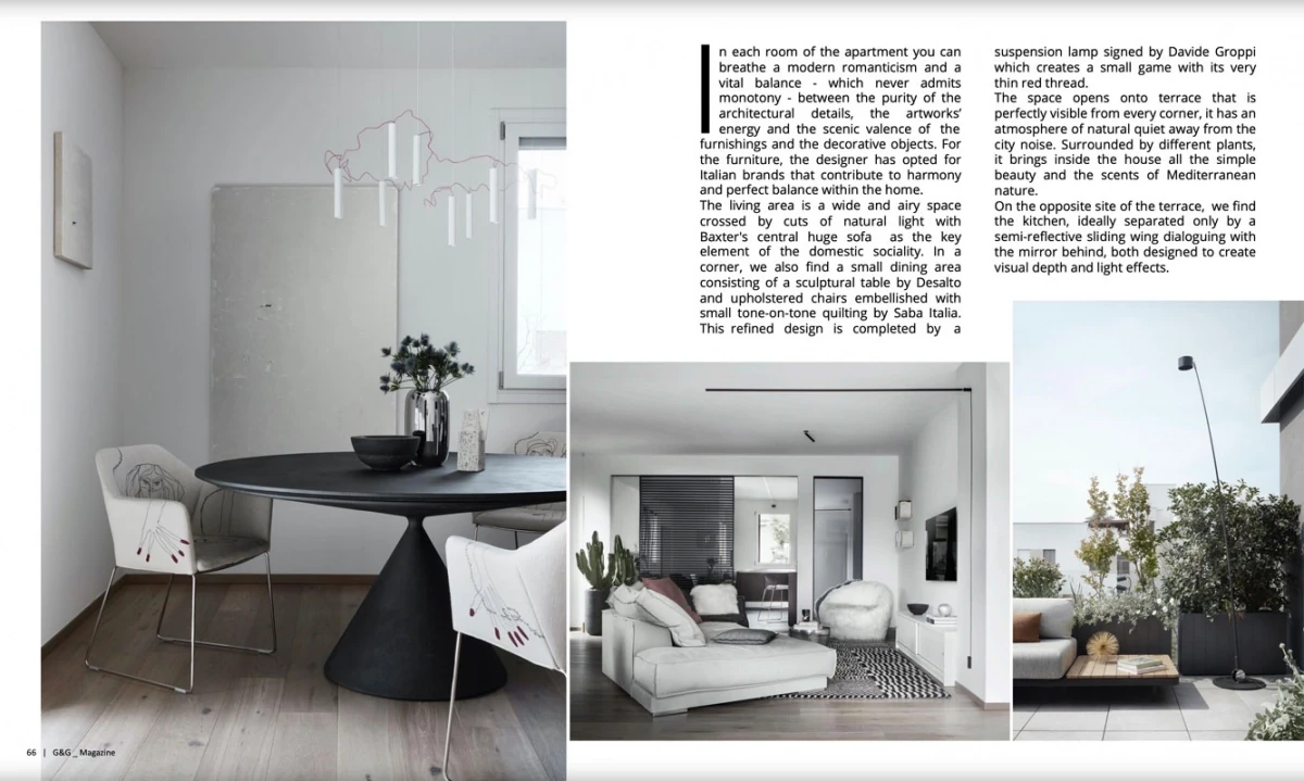 page from G&G Magazine: black round table and living area of the Contemporary Penthouse in Bologna, with terrace and greenery